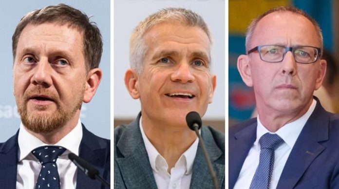 Warum ignoriert AfD-Kandidat Jörg Urban (r.) das Angebot des fraktionslosen Abgeordneten Michael Berger (Bildmitte), CDU-Amtsinhaber Michael Kretschmer zu stürzen?